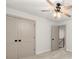 This bedroom features a closet with double doors and access to a hallway at 5125 Hyde Trl, Cumming, GA 30040