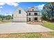 Stunning two-story home with a large driveway, a two-car garage, and a beautifully landscaped front yard at 5125 Hyde Trl, Cumming, GA 30040