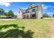 Front exterior view of a home featuring a well-manicured lawn at 5125 Hyde Trl, Cumming, GA 30040