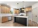 Open kitchen featuring stainless steel appliances, granite countertops, and a large center island at 5125 Hyde Trl, Cumming, GA 30040