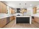 Modern kitchen with stainless steel appliances, custom cabinets, and island with bar seating at 5125 Hyde Trl, Cumming, GA 30040