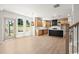 Bright kitchen with stainless steel appliances, black island, and lots of natural light at 5125 Hyde Trl, Cumming, GA 30040