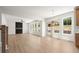Open floor plan with fireplace and large windows overlooking the back yard at 5125 Hyde Trl, Cumming, GA 30040