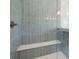 Modern shower with vertical tile and built in bench seat at 5125 Hyde Trl, Cumming, GA 30040