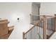 Elegant staircase featuring oak banister and black iron balusters at 5125 Hyde Trl, Cumming, GA 30040
