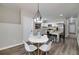 Open concept kitchen and dining area with an island and white countertops at 944 Woodland Ave, Atlanta, GA 30316