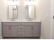 Bathroom features dual sinks, gray cabinets, a white countertop, and rectangular mirrors at 280 Briscoe Way # 38, Alpharetta, GA 30009