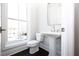 Bathroom with pedestal sink, toilet, and window with views of the outdoors at 280 Briscoe Way # 38, Alpharetta, GA 30009