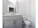 The bathroom has a gray vanity, modern fixtures, white countertops, and subway tile in the tub and shower area at 280 Briscoe Way # 38, Alpharetta, GA 30009