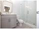 Modern bathroom with glass-enclosed shower, gray vanity with undermount sink, and stylish tile flooring at 280 Briscoe Way # 38, Alpharetta, GA 30009