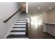 Hallway and staircase with dark wood accents and open floor plan at 280 Briscoe Way # 38, Alpharetta, GA 30009