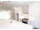 Bright kitchen featuring white cabinets, stainless steel appliances, and pendant lighting at 280 Briscoe Way # 38, Alpharetta, GA 30009
