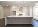 This expansive kitchen features a large island with seating and pendant lighting at 280 Briscoe Way # 38, Alpharetta, GA 30009