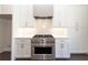 Modern kitchen with a stainless steel range and white cabinets with modern hardware at 280 Briscoe Way # 38, Alpharetta, GA 30009