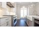 Modern kitchen featuring white cabinets, quartz countertops, and stainless appliances at 280 Briscoe Way # 38, Alpharetta, GA 30009