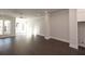 Open-concept living area featuring hardwood floors and large windows at 280 Briscoe Way # 38, Alpharetta, GA 30009