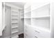 Organized walk-in closet features custom shelving, drawers, and ample storage for clothes and accessories at 280 Briscoe Way # 38, Alpharetta, GA 30009