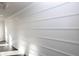 White accent wall with linear design and natural light streaming from window at 280 Briscoe Way # 38, Alpharetta, GA 30009