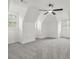 A large bedroom with vaulted ceilings, a ceiling fan, and multiple windows offering plenty of natural light at 110 Glen Eagle Way, Mcdonough, GA 30253