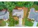 Inviting home with a well-maintained lawn, mature trees, and a long driveway, providing a welcoming atmosphere at 1446 Chadwick Ridge Ct, Lawrenceville, GA 30043