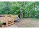 View of backyard with grill and access to deck via wooden steps at 1446 Chadwick Ridge Ct, Lawrenceville, GA 30043