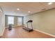 Finished basement area with exercise equipment and door to exterior at 1446 Chadwick Ridge Ct, Lawrenceville, GA 30043