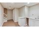Spacious basement with wood-look floors, utility sink, and access to the stairway at 1446 Chadwick Ridge Ct, Lawrenceville, GA 30043