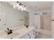 Bright bathroom featuring a double sink vanity, a large mirror, and a tub-shower combo at 1446 Chadwick Ridge Ct, Lawrenceville, GA 30043