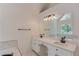 Bright Primary bath featuring double sinks, white cabinetry, and a large frameless mirror at 1446 Chadwick Ridge Ct, Lawrenceville, GA 30043