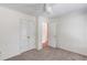 This bedroom offers a ceiling fan and a double closet at 1446 Chadwick Ridge Ct, Lawrenceville, GA 30043