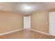 Finished room has hardwood flooring and beige walls, offering closet space and access to another room at 1446 Chadwick Ridge Ct, Lawrenceville, GA 30043