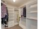 Walk-in closet featuring custom shelving and ample storage space for clothes and accessories at 1446 Chadwick Ridge Ct, Lawrenceville, GA 30043