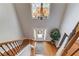 Spacious foyer with hardwood floors, staircase, and chandelier at 1446 Chadwick Ridge Ct, Lawrenceville, GA 30043