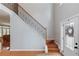 Grand foyer featuring hardwood floors, staircase with iron spindles, and natural light at 1446 Chadwick Ridge Ct, Lawrenceville, GA 30043