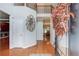 Elegant foyer featuring gleaming hardwood floors, a staircase, and an open floor plan at 1446 Chadwick Ridge Ct, Lawrenceville, GA 30043