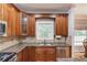 Well-equipped kitchen with granite countertops, stainless appliances, and custom wood cabinets at 1446 Chadwick Ridge Ct, Lawrenceville, GA 30043