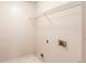 A utility room features a wire rack shelf and hookups at 1446 Chadwick Ridge Ct, Lawrenceville, GA 30043