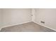 Neutrally painted bedroom with wall-to-wall carpeting and a closet, creating a serene retreat at 6219 Heardsville Rd, Cumming, GA 30028