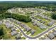 An aerial view of a neatly planned residential community surrounded by lush greenery, providing a serene and picturesque setting at 198 Colbury St, Villa Rica, GA 30180
