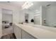 Bathroom featuring a long countertop, modern lighting, and a partial view of the bedroom at 198 Colbury St, Villa Rica, GA 30180