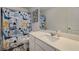 Bathroom featuring a vanity with a sink, a mirror, and dinosaur-themed decor at 198 Colbury St, Villa Rica, GA 30180