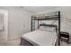 This bedroom features a bunk bed with a metal frame and a comfortable mattress, perfect for maximizing space at 198 Colbury St, Villa Rica, GA 30180