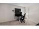 This bedroom is equipped with a modern desk setup and two large screens that are ideal for gaming or entertainment at 198 Colbury St, Villa Rica, GA 30180