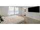 Comfortable bedroom with neutral colors, a bed, a TV, and carpeted flooring at 198 Colbury St, Villa Rica, GA 30180