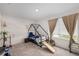 Cozy bedroom with a playful design featuring a unique house-shaped bed frame and lots of natural light from the windows at 198 Colbury St, Villa Rica, GA 30180