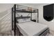 Bedroom with bunk bed with metal frame and gray headboard at 198 Colbury St, Villa Rica, GA 30180