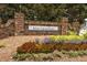 Charming stone community sign with colorful landscaping at the entrance, creating a welcoming and appealing first impression at 198 Colbury St, Villa Rica, GA 30180