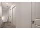 Hallway with carpeted flooring and white doors providing access to multiple rooms at 198 Colbury St, Villa Rica, GA 30180