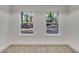 Inviting bedroom featuring large windows providing natural light and views of the surrounding nature at 2358 Tilson Rd, Decatur, GA 30032