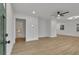Bright living room featuring hardwood floors, ceiling fan, and freshly painted white walls at 2358 Tilson Rd, Decatur, GA 30032